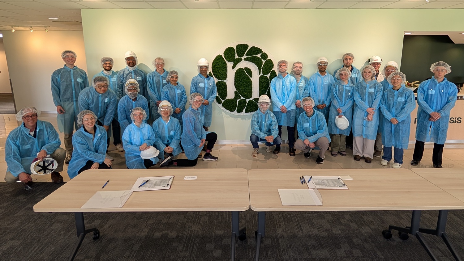Alternative protein students and industry professionals in lab coats and hair nets