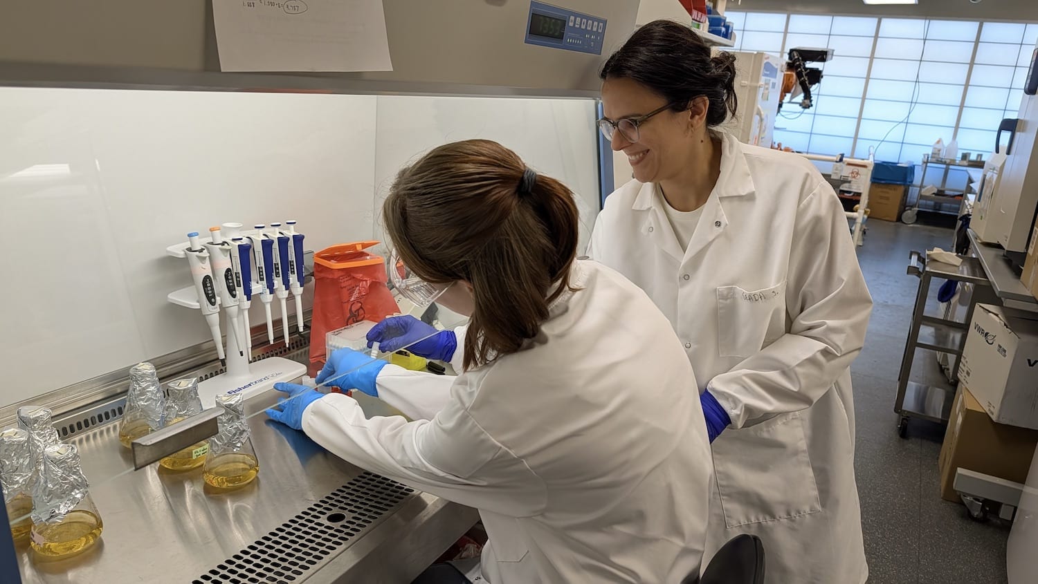 NC State doctoral student Seada Sloboda assists a student in the Bezos Center for Sustainable Protein lab.